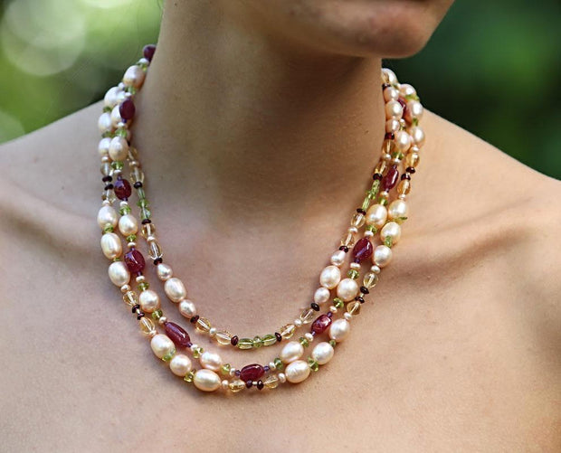 14kt yellow gold 3-strand necklace. Gems:  pearls, rubies, garnet, citrine, peridot, and amethyst.  A celebration of Stewart tartans. WOS monogram clasp.