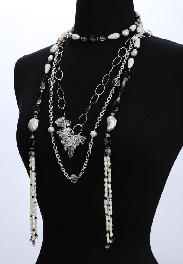 Sterling silver textured chain.  Gems: freshwater pearl and crystal quartz.  Beautiful layered.  Approximate length 32."  