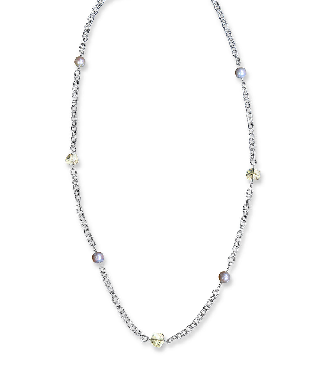 Sterling silver textured chain.  Gems: freshwater pearl and crystal quartz.  Approximate length 32."  