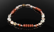 Princess necklace.  Gem necklace of Keshi and button freshwater pearls, sunstone, goldstone, and strawberry quartz.  WOS 14kt yellow gold logo clasp. 