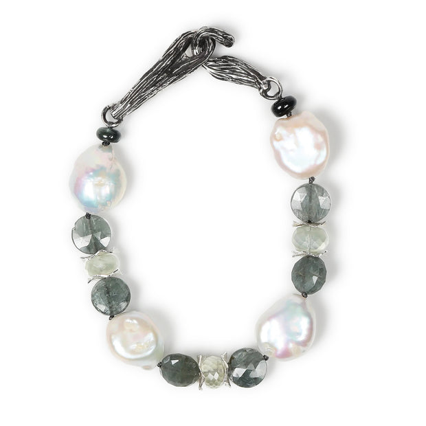 Sterling silver and gem bracelet.  Gems: Ceylon moonstone, freshwater pearls, and moss aqua.   White Orchid Studio’s vanilla bean clasp and spacers.  Approximate length 9.".”
