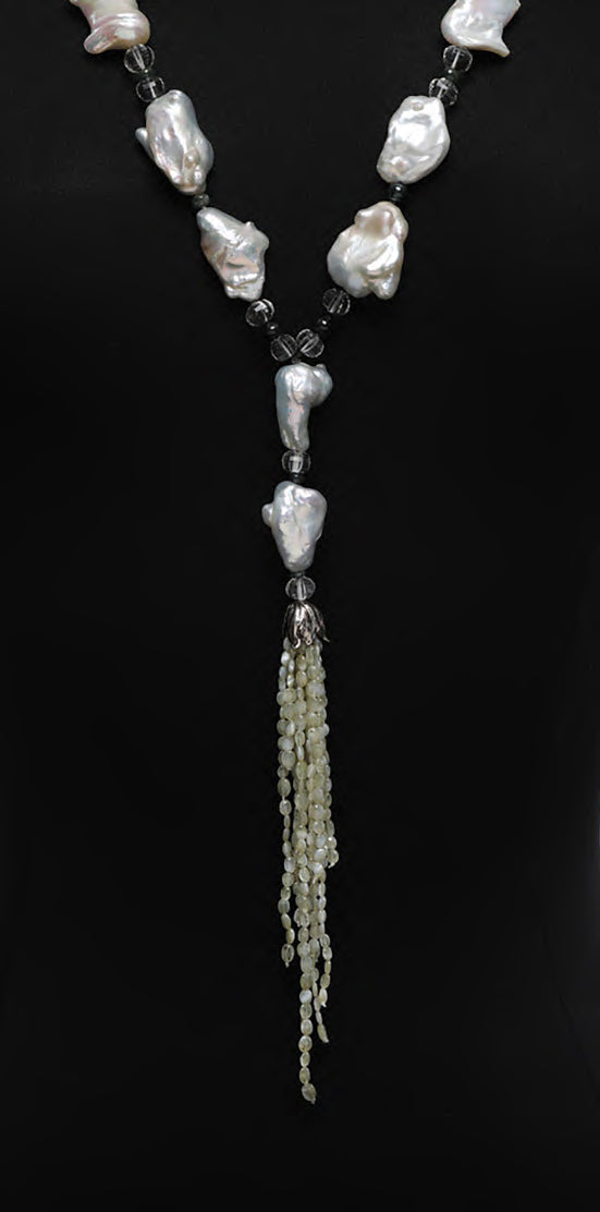 Sterling silver. Gems: pearl, prasiolite, sapphire, and cat's eye chrysoberyl. White Orchid Studio’s floral bead cap. Approximate length 45."