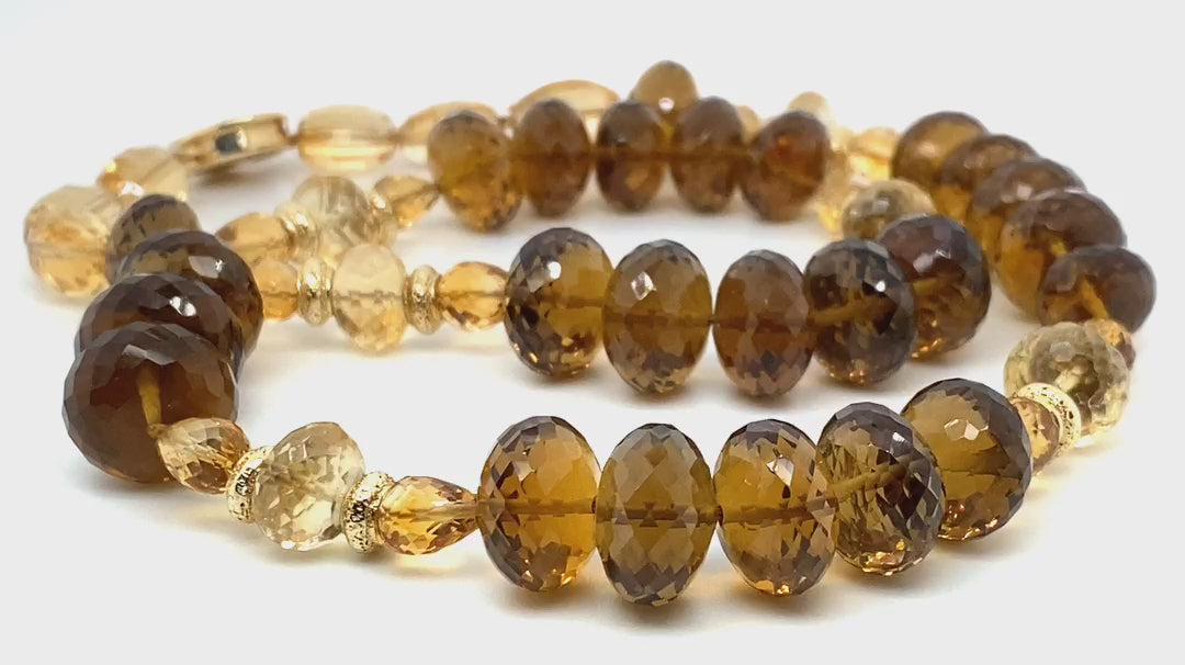 14kt yellow gold.  Gems: whiskey quartz and citrine. Gold spacers and White Orchid Studio’s vanilla bean clasp.  Approximate length 18”