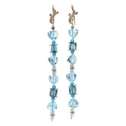 Sky and London blue topaz sparkle against Sleeping Beauty turquoise to create a drop ear wire, approximately 4” long.  14kt yellow gold.  White Orchid Studio’s vanilla bean ear wires and spacers.  