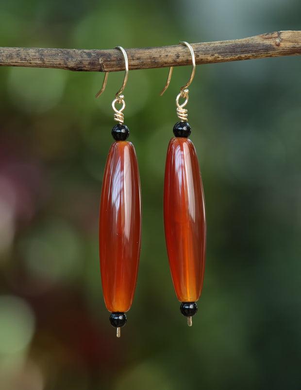 14kt yellow gold earrings.  Gems: carnelian and onyx. Approximate length 2.5.”
