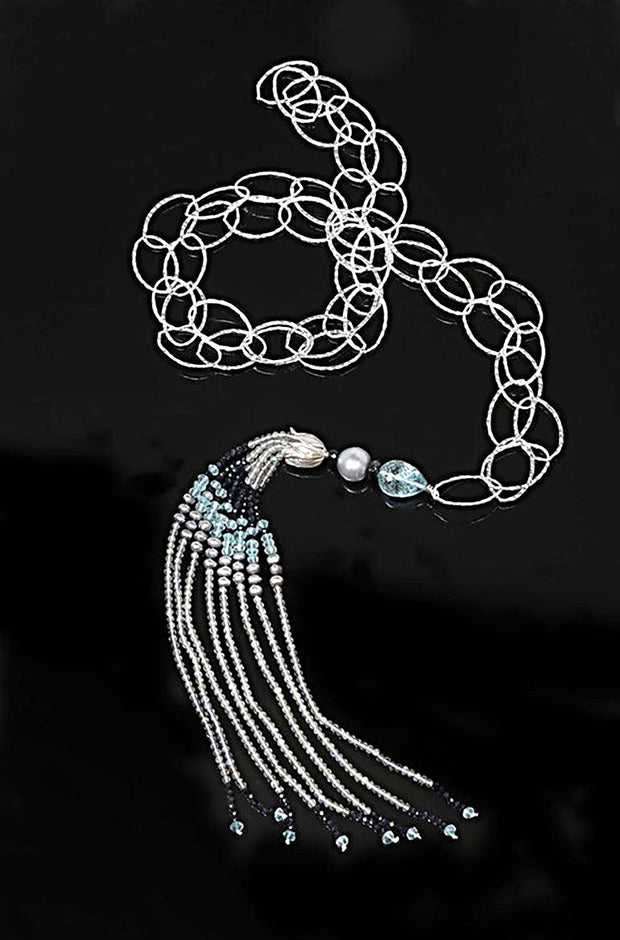 Sterling silver chain:  Gems: labradorite, silver freshwater pearls, sky blue topaz, and deep blue sapphires.  Approximate length 44” + 8.”