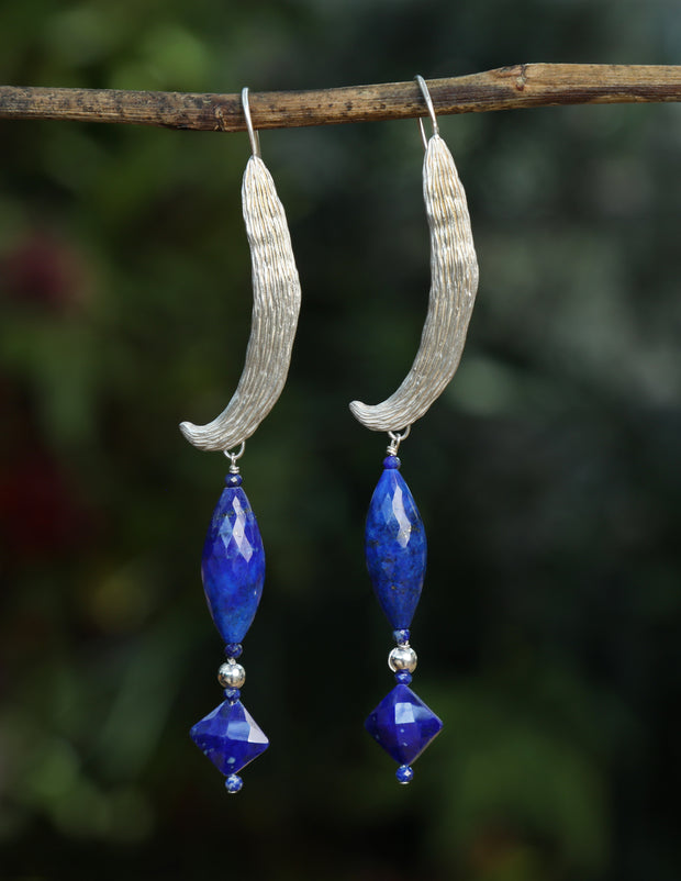Sterling silver.  Gem: 3 forms of Lapis lazuli.  White Orchid Studio created the ear wire to resemble a vanilla bean.  An approximate length of 3.5.” 