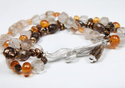 Precious topaz, smoky quartz, mandarin garnet, and Keshi pearl 3-strand bracelet. Sterling silver, vanilla bean clasp. 7.75”