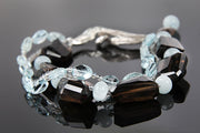 Smoky quartz, aquamarine, hypersthene, and silver bracelet.  Sterling silver.  White Orchid Studio vanilla bean clasp.  8”