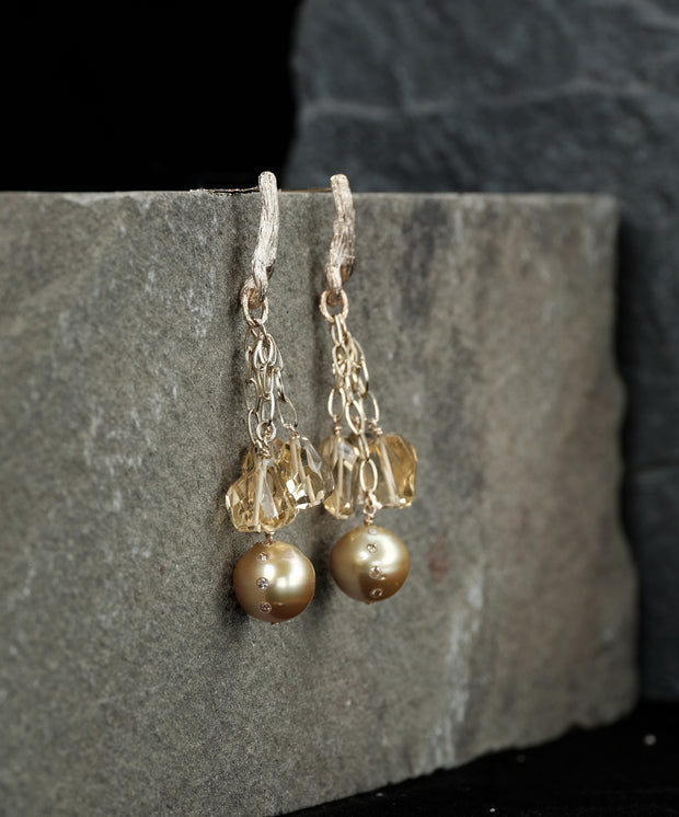 South sea pearls, Champagne diamonds (approximately .64 cts. t.w.), and citrine chandelier earrings.  14kt yellow gold chains and White Orchid Studio’s vanilla bean earrings. Approximately 2.5” long.