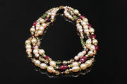 14kt yellow gold 3-strand necklace. Gems:  pearls, rubies, garnet, citrine, peridot, and amethyst.  A celebration of Stewart tartans. WOS monogram clasp.