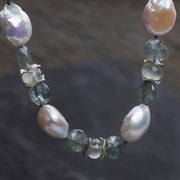 Sterling silver and gem bracelet.  Gems: Ceylon moonstone, freshwater pearls, and moss aqua.   White Orchid Studio’s vanilla bean clasp and spacers.  Approximate length 9.”