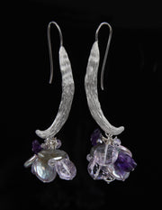 Sterling silver.  Gems: dark and light amethyst, silver and pistachio freshwater pearls, and labradorite.  White Orchid Studio’s vanilla bean ear wire.  Approximate length 2.5."  