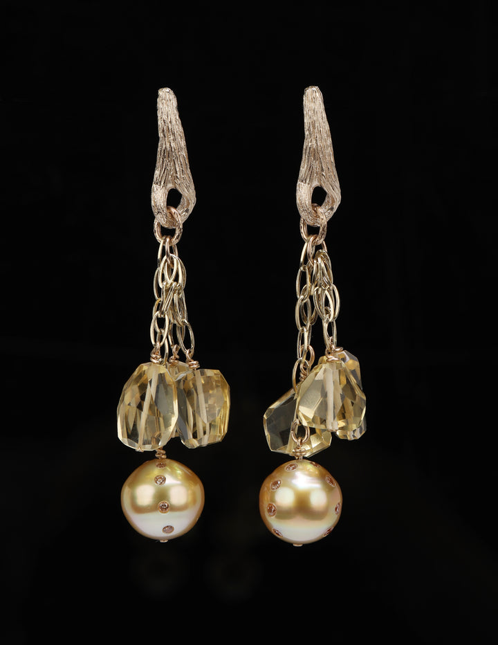 South sea pearls, Champagne diamonds (approximately .64 cts. t.w.), and citrine chandelier earrings.  14kt yellow gold chains and White Orchid Studio’s vanilla bean earrings. Approximately 2.5” long.