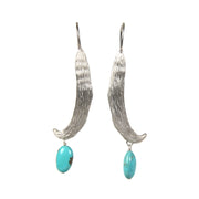 Natural turquoise.  A sterling silver custom, vanilla bean ear wire.  An approximate length of 2.5.”