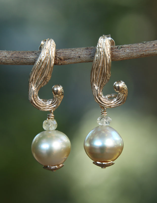 14kt white gold earrings.  Gem: South Sea pearl and natural Songea sapphires.  Approximate length is 1.5.”