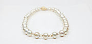 18kt yellow gold clasp and granulated spacers.  Gems: golden South Sea pearls and Songea sapphires. 20.”