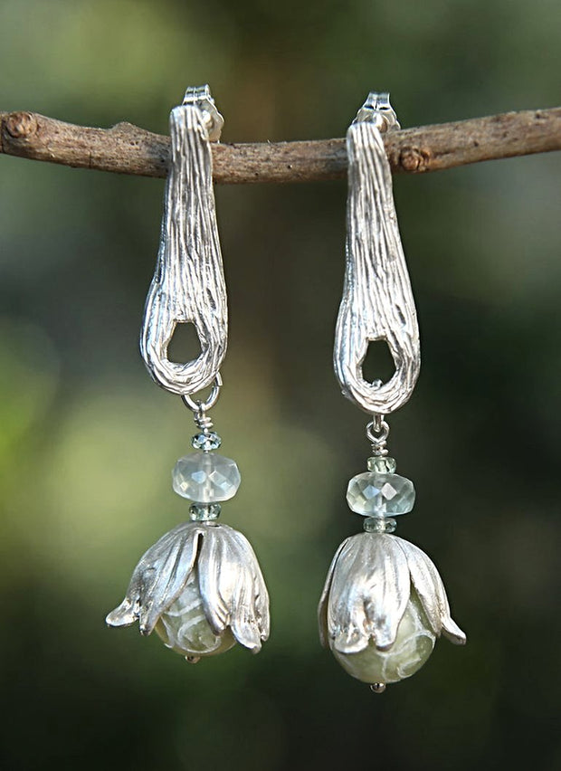 Sterling silver:  Gems: carved jade, Ceylon moonstone, and Champagne zircon. White Orchid Studio vanilla bean earring and bead caps.  Approximate length 3.”