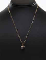 14kt yellow gold ribbon, set with 16 Champagne diamonds (approx .11 cts) on a black spinel cube.
