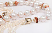 14kt yellow gold.  Gems: pearl (12-16 mm), button pearl (3mm), sunstone, and goldstone.  White Orchid Studio’s floral bead caps and spacers.  Approximate length:  56”