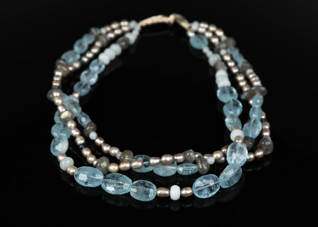  14kt white gold 3-strand necklace.  Gems: pearl, aquamarine, topaz, and labradorite.  Approximate length 17."  