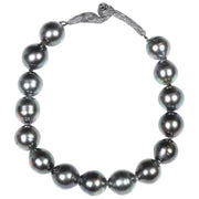 14kt white gold.  Gems: black south sea pearl and black diamonds. White Orchid Studio’s vanilla bean clasp is antiqued to enhance the texture. Approximate length 8.”