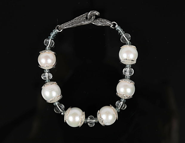 Gem bracelet: freshwater pearls (11mm), prasiolite, and apatite.  White Orchid Studio’s vanilla bean clasp and custom spacers in sterling silver.  8.5.” 