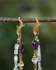 Drop earrings.  WOS vanilla bean earring of 14kt yellow gold.  3 strands of amethyst, aquamarine, and gold.