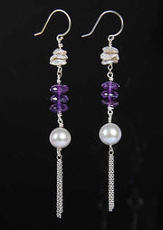 Drop earrings. Silver freshwater pearls combine with amethyst and sterling silver chain on sterling shepherd hooks .    