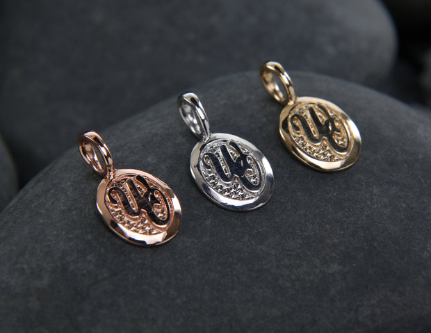 14kt rose, white, and yellow gold charms. The approximate dimensions are 11 mm wide and 14 mm long.