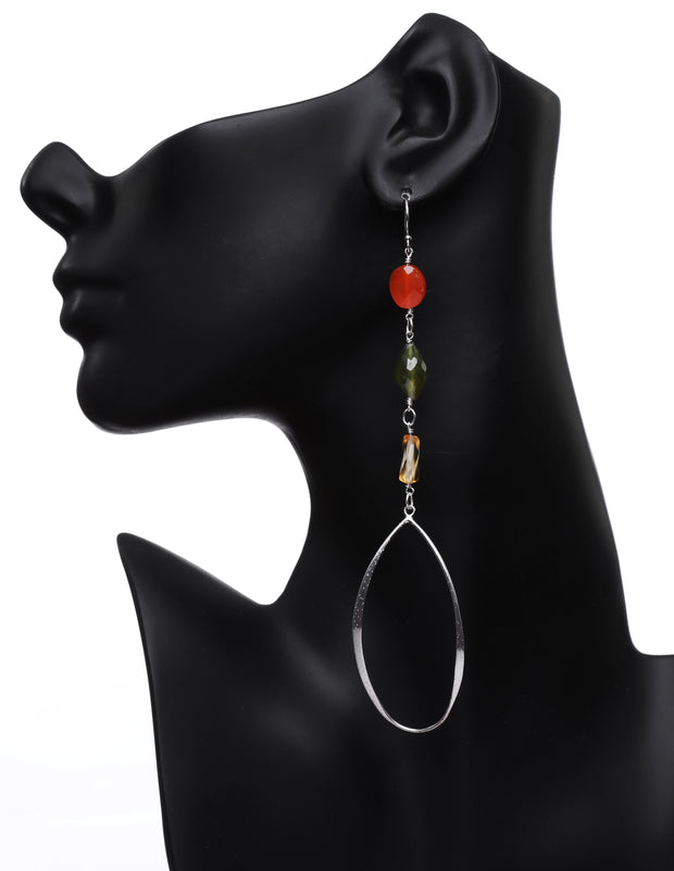 A dangle ear wire: carnelian, idocrase, citrine, silver.  The silver is sterling, dusted with diamonds and protected with rhodium. The approximate length of  5.5."