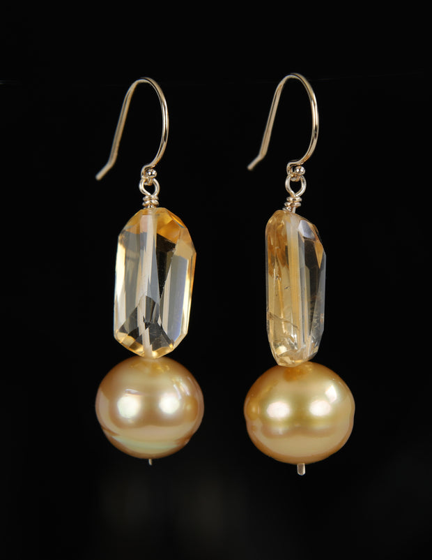a drop ear wire featuring citrine nuggets and golden freshwater pearls on 14kt yellow gold shepherd hooks.  An approximate 2" drop.