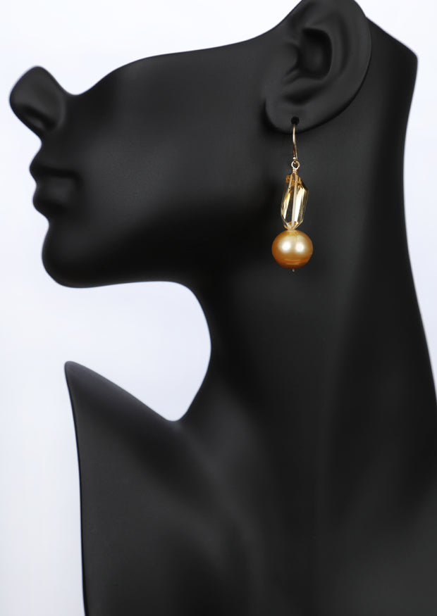 a drop ear wire featuring citrine nuggets and golden freshwater pearls on 14kt yellow gold shepherd hooks.  An approximate 2" drop.