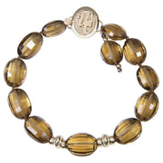 Gem and gold bracelet.  Golden quartz glows next to 14kt yellow gold rondelles and the White Orchid Studio logo clasp.  7"