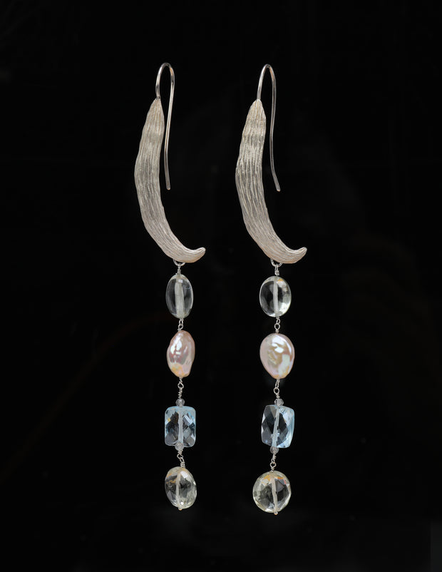 Sterling silver.  Gems: prasiolite, topaz, and pearl. White Orchid Studio’s ear wire resembles a vanilla bean. An approximate length of 4.5.”