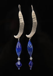 Sterling silver.  Gem: 3 forms of Lapis lazuli.  White Orchid Studio created the ear wire to resemble a vanilla bean.  An approximate length of 3.5.” 